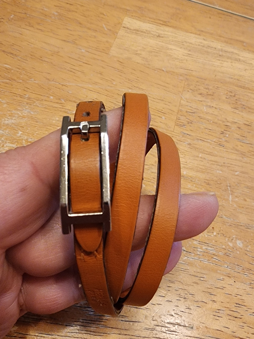 Hermès Hapi 3 leather wrap bracelet featuring a palladium-plated hardware clasp.